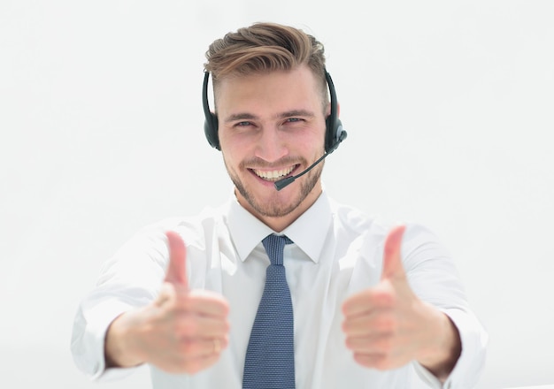 Close upsmiling call center employee showing thumbs upphoto with copy space