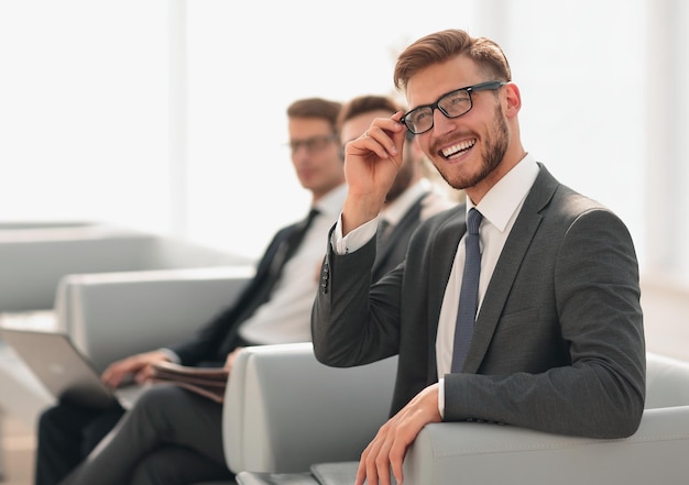 Close upsuccessful business man sitting in a modern officebusiness people