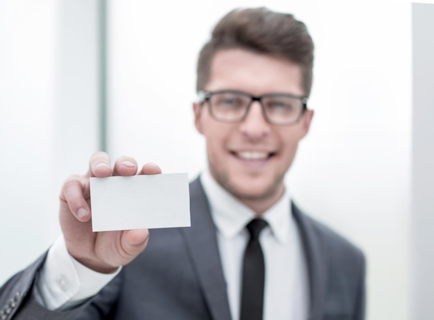 Close upsuccessful businessman showing his business card