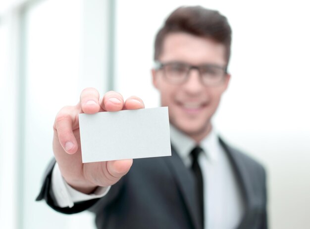 Close upsuccessful businessman showing his business card