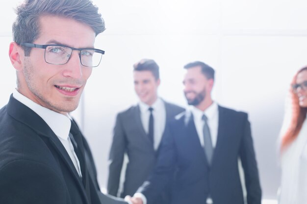 Close upsuccessful businessman standing in the office