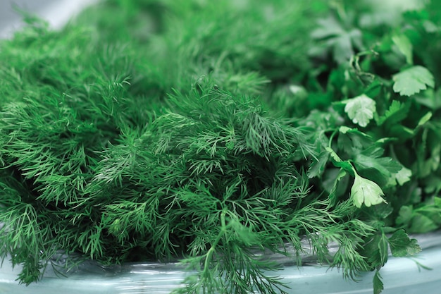 Close upthe background image of sprigs of dill and parsley