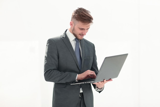 Close upthe businessman is using a new laptopisolated on white