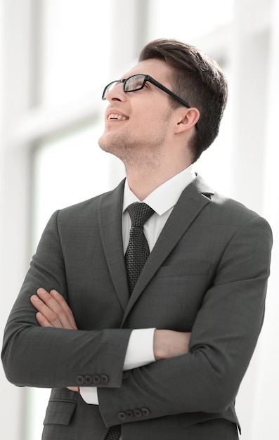 Close upyoung businessman looking up at copy space