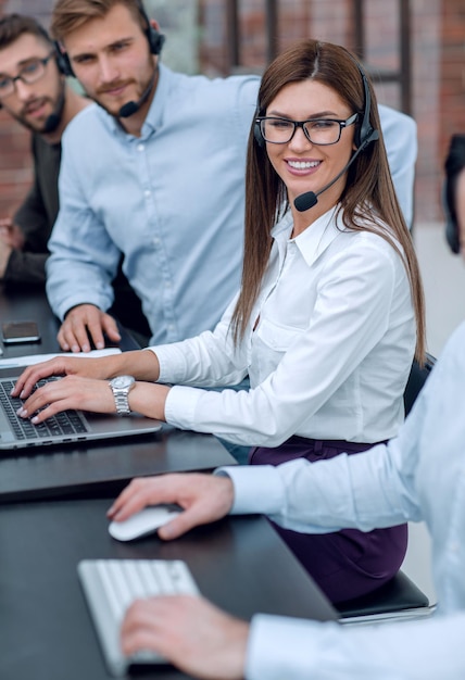 Close upyoung call center staff sitting at the Desk business concept