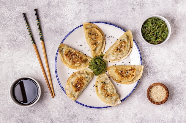 Close view on dumpling snacks with chopsticks