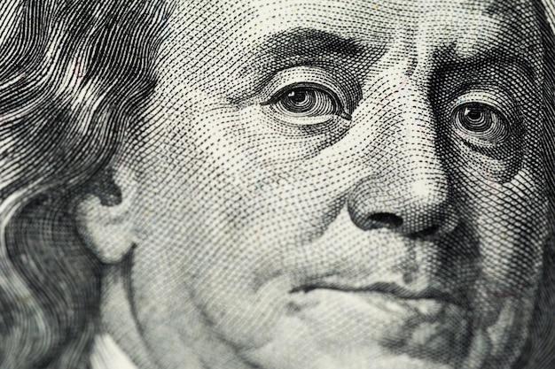 A close view of engraving portrait of Ben Franklin of old one hundred us dollars banknote