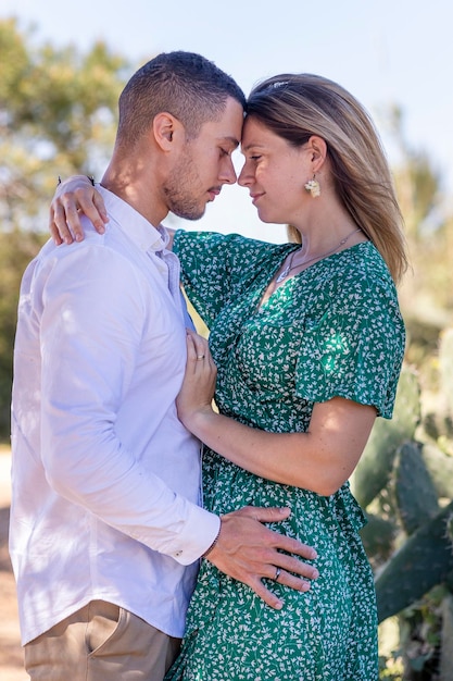 Close view of a happy young european couple holding together