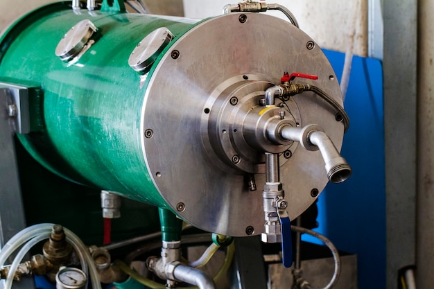 Close view of olive oil factory machinery.