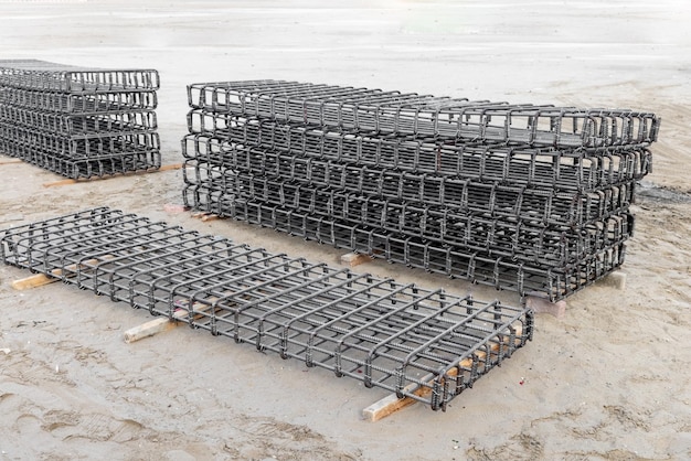 Close view on the steel reinforcing bars steel mesh for\
construction steel rebars for reinforced