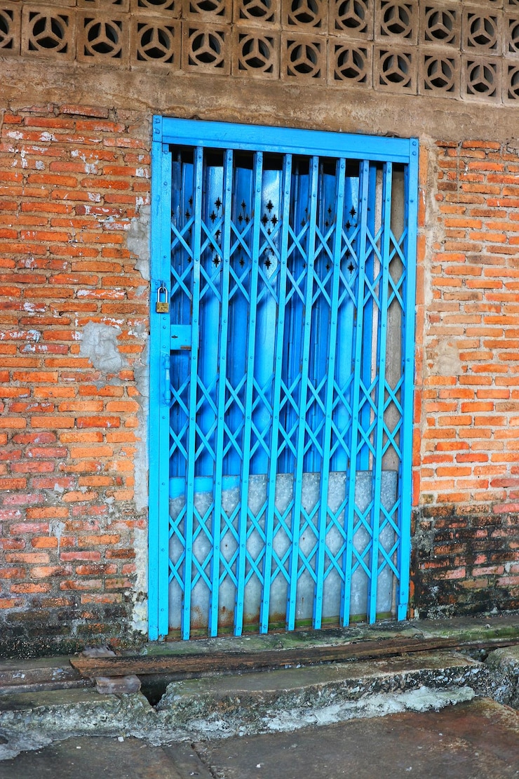 फोटो closed blue window on wall of building