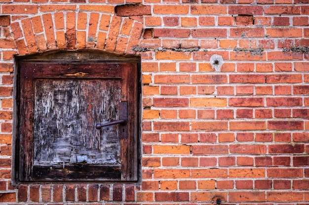 Closed door on brick wall