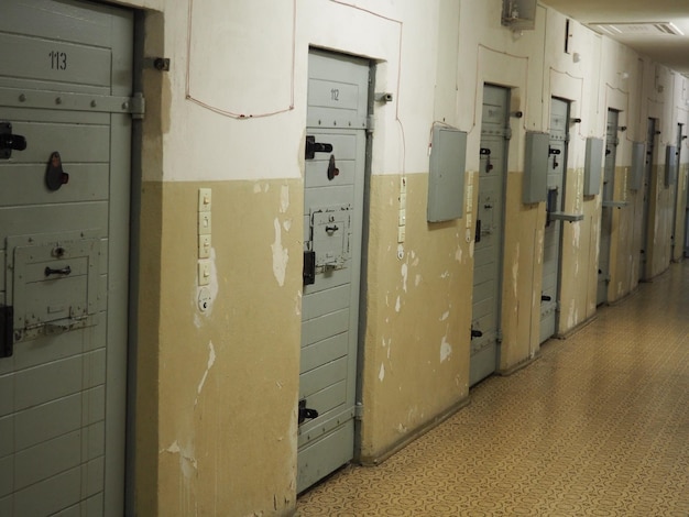 Photo closed doors at corridor of prison