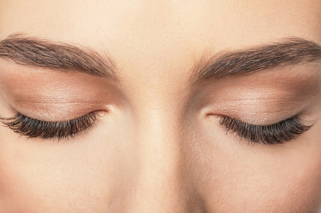 closed female eyes with long eyelashes, closeup