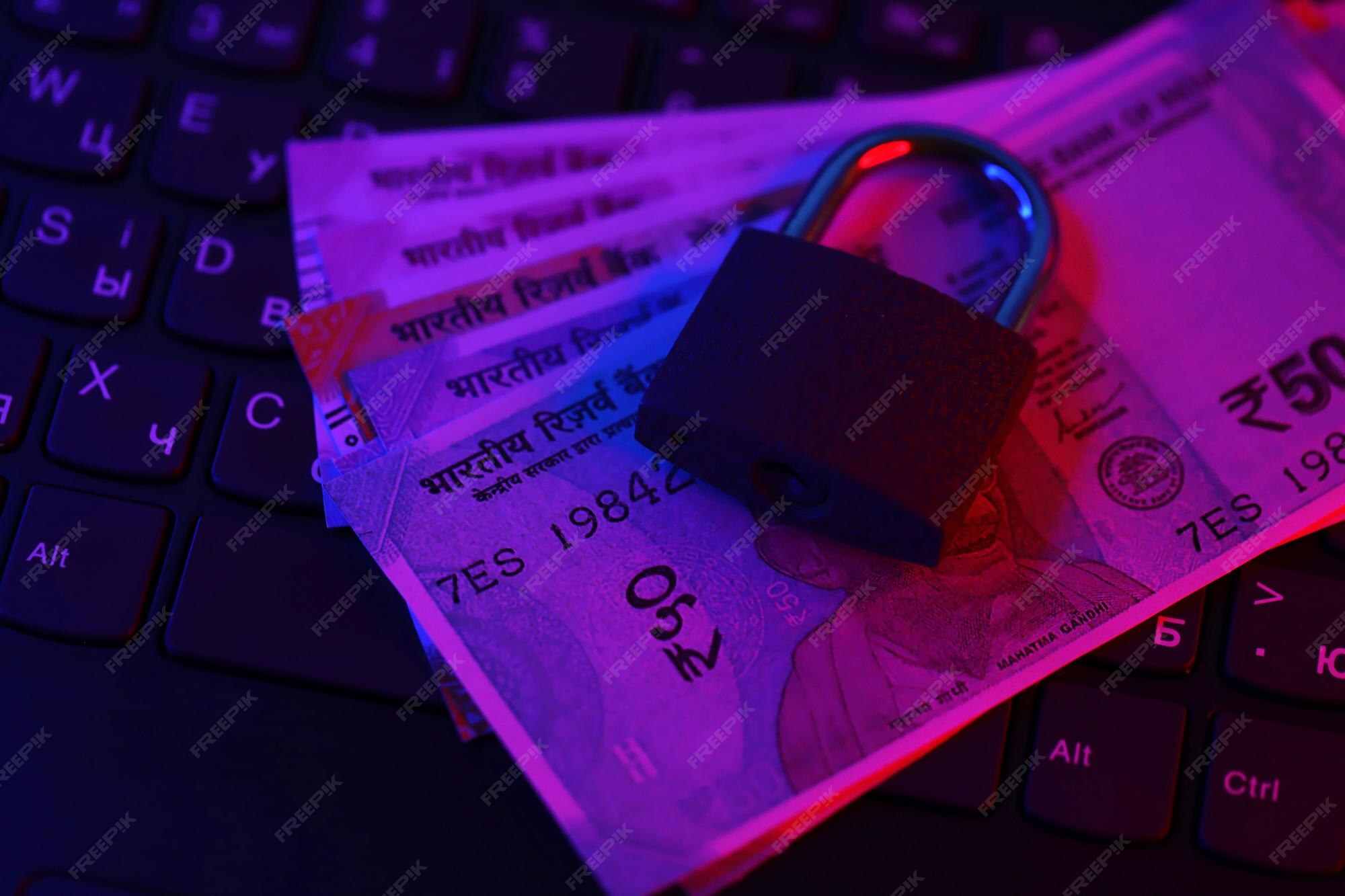 Premium Photo Closed Padlock With Indian Rupees Money Bills On Laptop premium-photo-closed-padlock-with-indian-rupees-money-bills-on-laptop