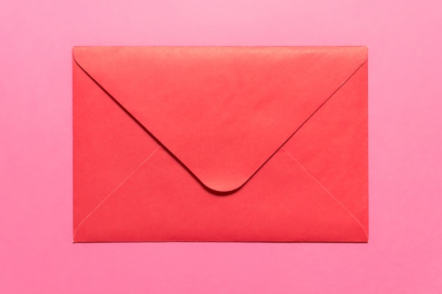 Closed pink envelope on pink backgound