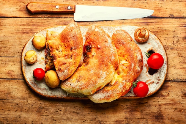 Closed pizza with mushrooms Calzone  Italian pie