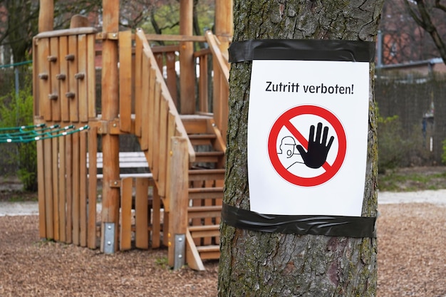 Photo closed playground with zutritt verboten sign meaning no entry in german