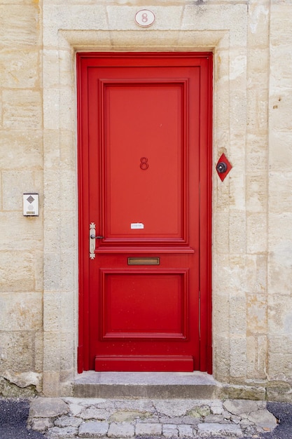 Photo closed red door of house