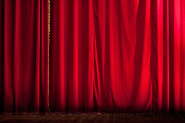 Closed red theater curtain backdrop