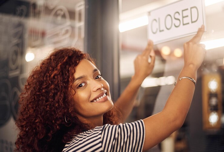 Photo closed sign and portrait of happy woman at shop store and notice of retail shopping time board and advertisement small business owner advertising closing of cafe information or storefront poster