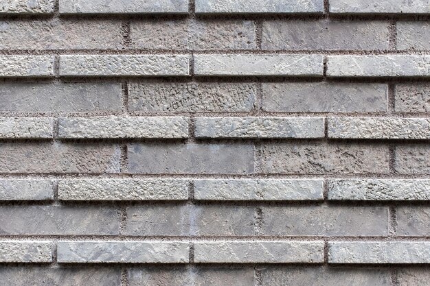 Closed up grey brick wall texture Architectural material construction