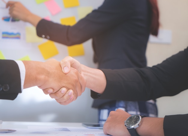 Closed up hand shaking in business meeting deal