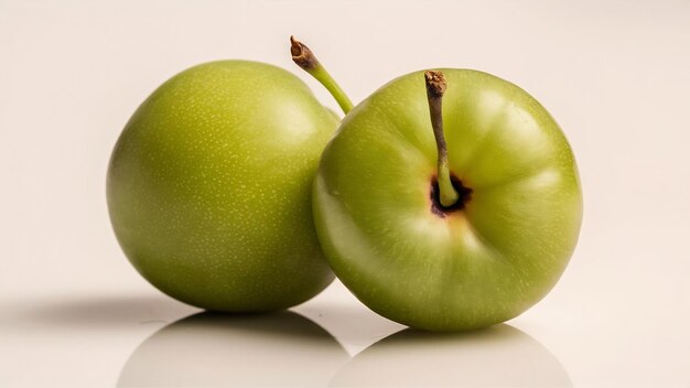 Photo a closed up top view green cherry plum round isolated sour fresh mellow on the white background fru