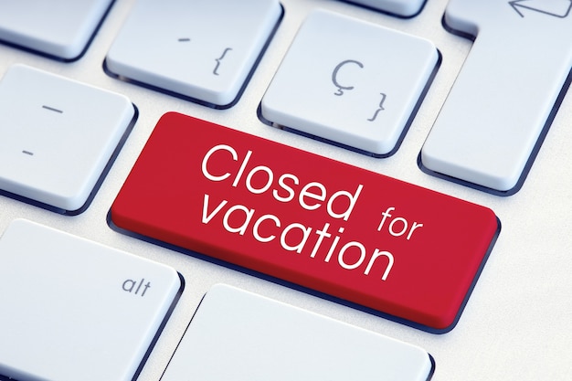 Closed for vacation phrase on computer Keyboard Key