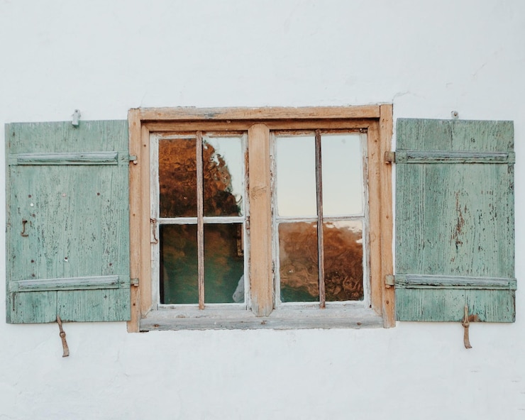 Photo closed window of old building