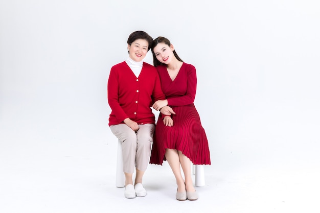 Closeness of mother and daughter isolated on white