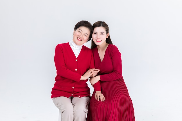 Closeness of mother and daughter isolated on white