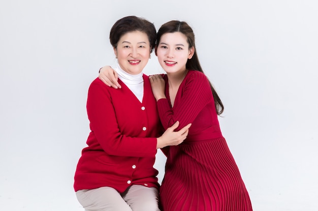 Closeness of mother and daughter isolated on white