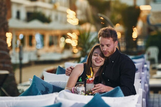 Closeness of the people Happy young couple is together on their vacation Outdoors at sunny daytime