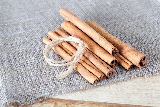 The closest to a linen tablecloth is coarsely made fragrant cinnamon sticks and a rope for binding