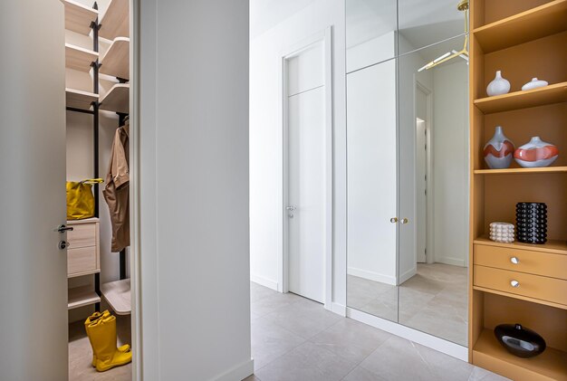 A closet with a yellow bag hanging from the ceiling