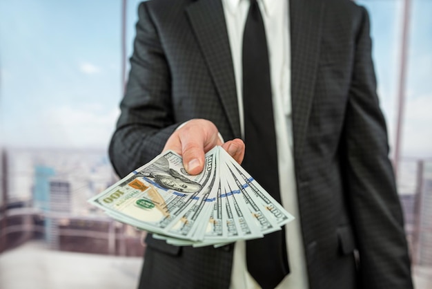 Closeup 100 one hundred us dollar banknotes in male hands