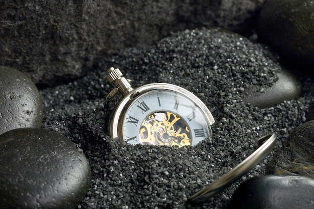 CloseUp 4K Ultra HD Image of Stopwatch Buried in Sand