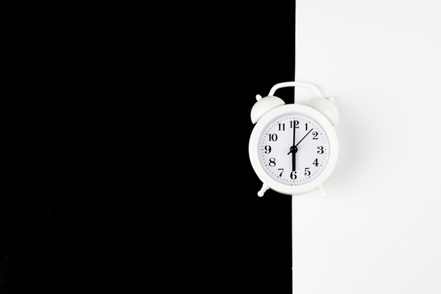 closeup alarm clock for decorate paper background in black and white tone with copy space.