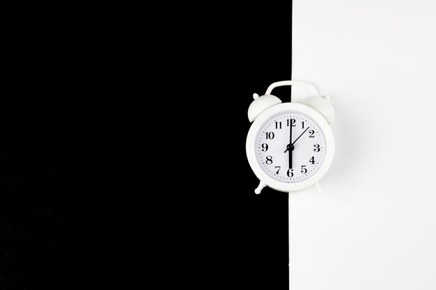 Closeup alarm clock for decorate paper background in black and white tone with copy space.