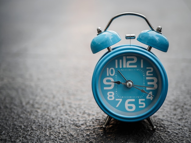 Closeup alarm clock  with black background.