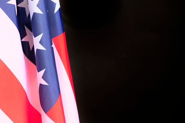 Photo closeup of american flag on black background