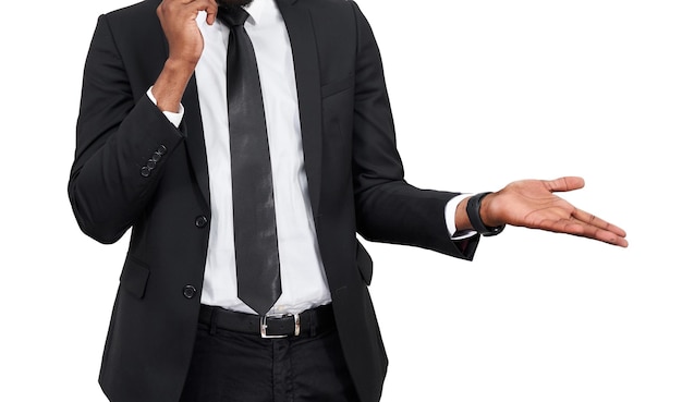 Closeup of angry young african man screaming while talking on smartphone isolated on white background