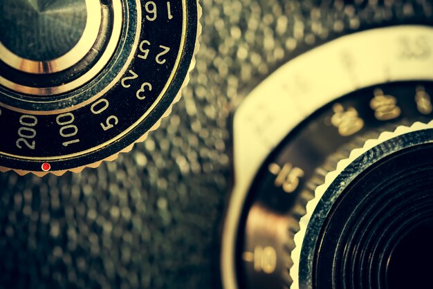 Closeup of apart of old film cameras with free copy space, vintage background.