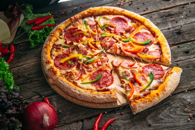 Photo closeup on appetizing hot pizza pepperoni with salami