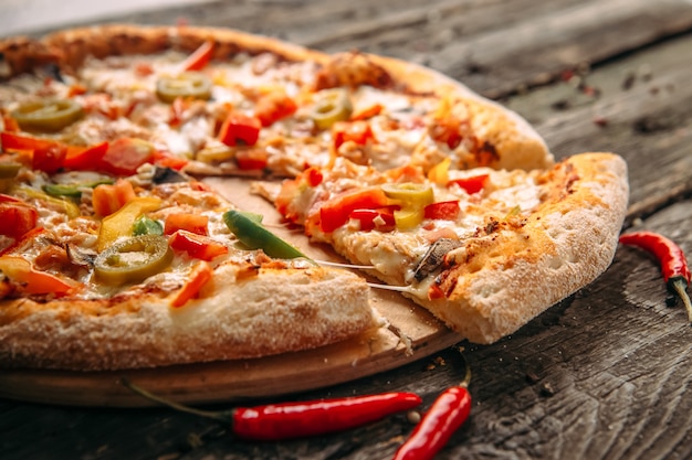 Closeup on appetizing pepper pizza with jalapeno