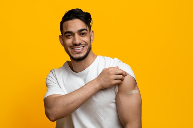 Closeup of arabic man with medical band on his shoulder