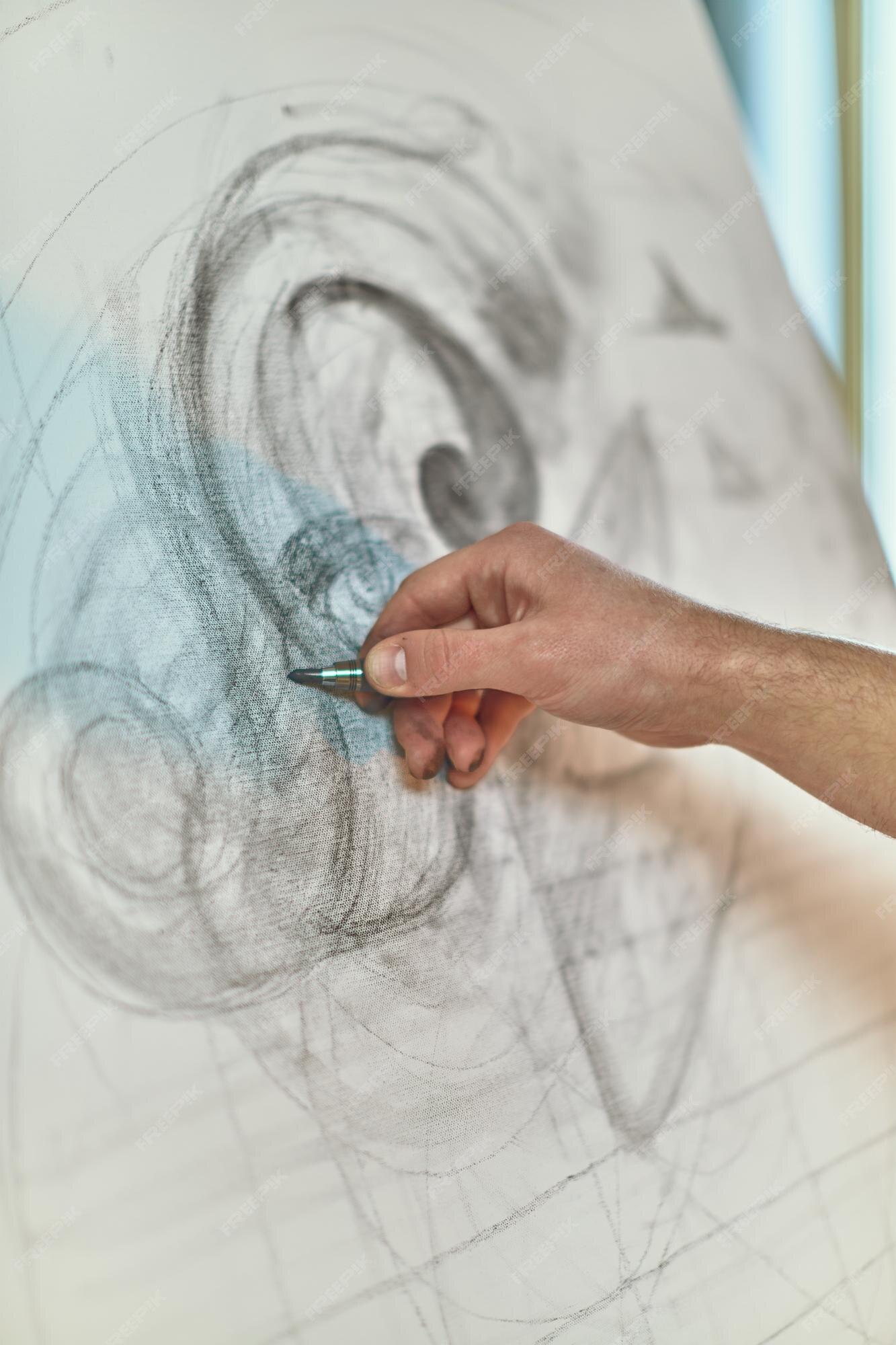 Premium Photo  Closeup artist drawing pencil draft on canvas designers  hand sketching project modern art creative