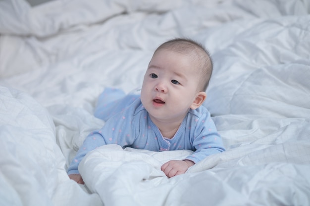 Closeup asian baby boy on bed