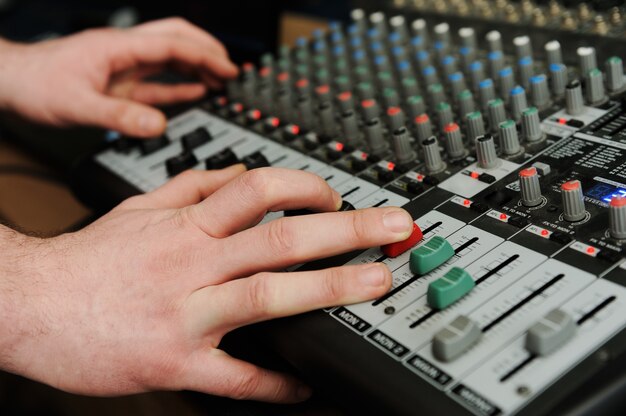 Closeup audio mixer with buttons